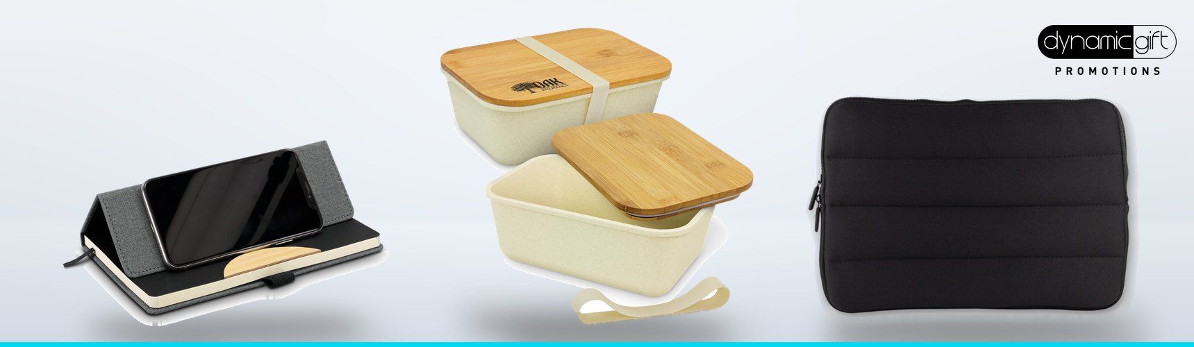 Notebook with a built in phone stand, bamboo lid lunch boxes and a black padded laptop sleeve