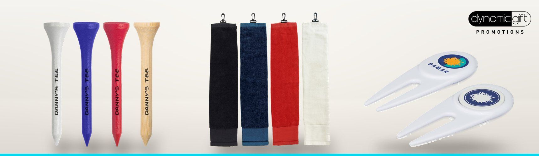 Custom printed golf tees, clip on golf towels in four colours and branded divot repairers lined up on a light background
