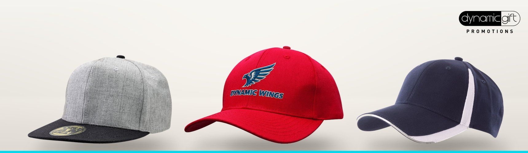 Grey snapback, red embroidered cotton twill cap and navy sports cap lined up on a light background
