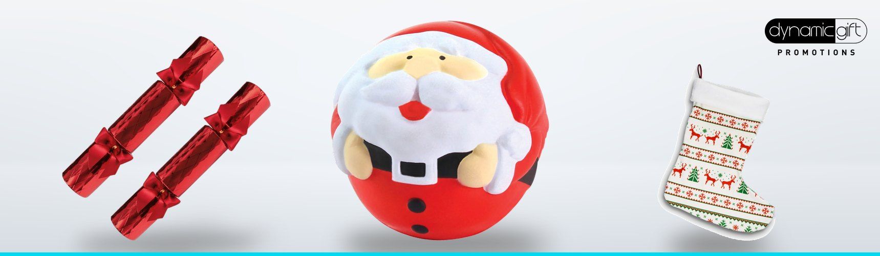 Red Christmas crackers, a Santa stress ball and a full colour printed Christmas stocking on a light background