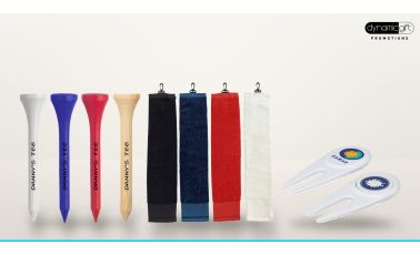 Custom printed golf tees, clip on golf towels in four colours and branded divot repairers lined up on a light background