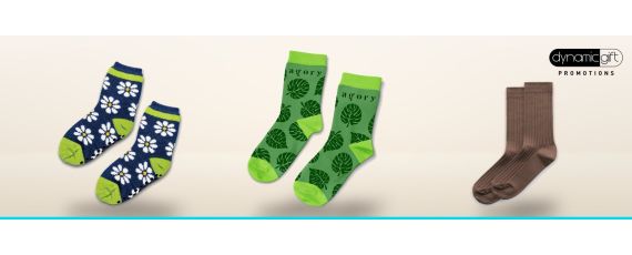 Kids grip socks with daisies, custom printed leaf crew socks and brown ribbed socks lined up on a light background
