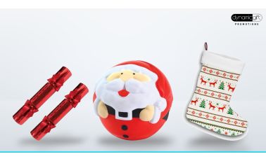 Red Christmas crackers, a Santa stress ball and a full colour printed Christmas stocking on a light background